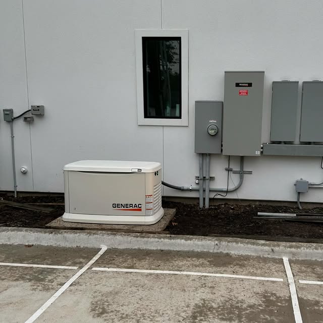 Generac generator beside electrical service equipment on an E.S.H. Electric 400 amp service project.