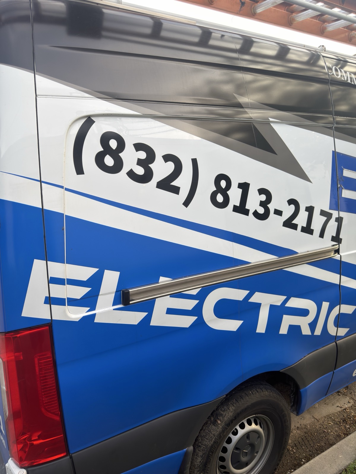Side view of the E.S.H. Electric service van showing the phone number 832-813-2171.